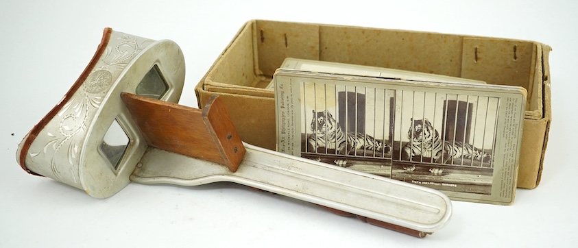 A group of stereographic photos including Windsor, London, Derbyshire, Canada, Switzerland, two erotic subjects, etc., and a viewer, missing card holder. Condition - poor to fair